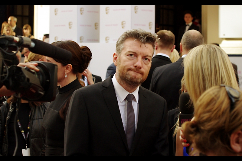 The lovingly arranged hair is magnificent, but I can't pretend to know who this is. (edited to add : Charlie Brooker)