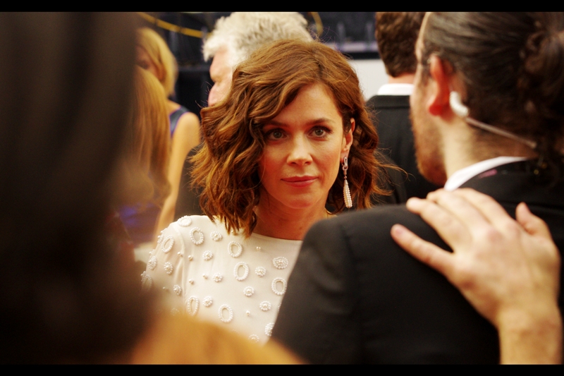 I don't know who this is, but somebody went to a lot of trouble to make those amoeba-style bumps on her dress. Or at least design them. Or designed a computer that designed them. (edited to add : Anna Friel. Who I should have recognised, distracting micro-oragnisms-in-macro top or not)