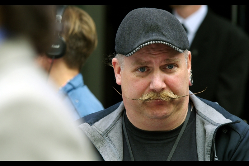 Good news for fans of awesome moustaches : here's a photo. This man is actually part of the setup crew and not in the film, which I think is a major oversight by Disney.