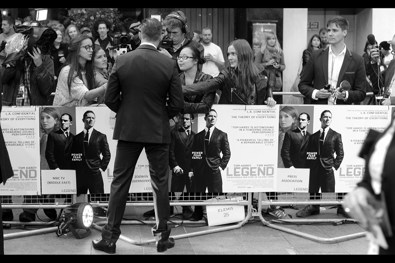 (Man at far right) : "How come Tom Hardy gets all the attention from all the Babez and I don't?" It's probably the shoes. Babez, along with not minding being called 'Babez' apparently dig nice shoes.