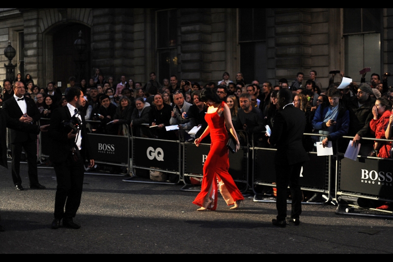 "Another woman wore red to this thing? I'm leaving" Daisy Lowe heads for the Paparazzi cordon, hoping nobody noticed.