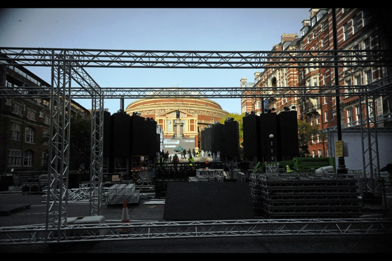 T-Minus 30 hours. It's just after midday, I've returned, and the queue has grown. So has the scaffolding. The story with wristbands is : you don't talk about wristbands.