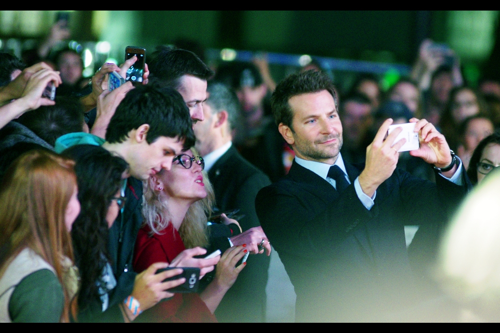 Girl : 'Please don't drop that phone. I need it to photograph Bradley Cooper...'