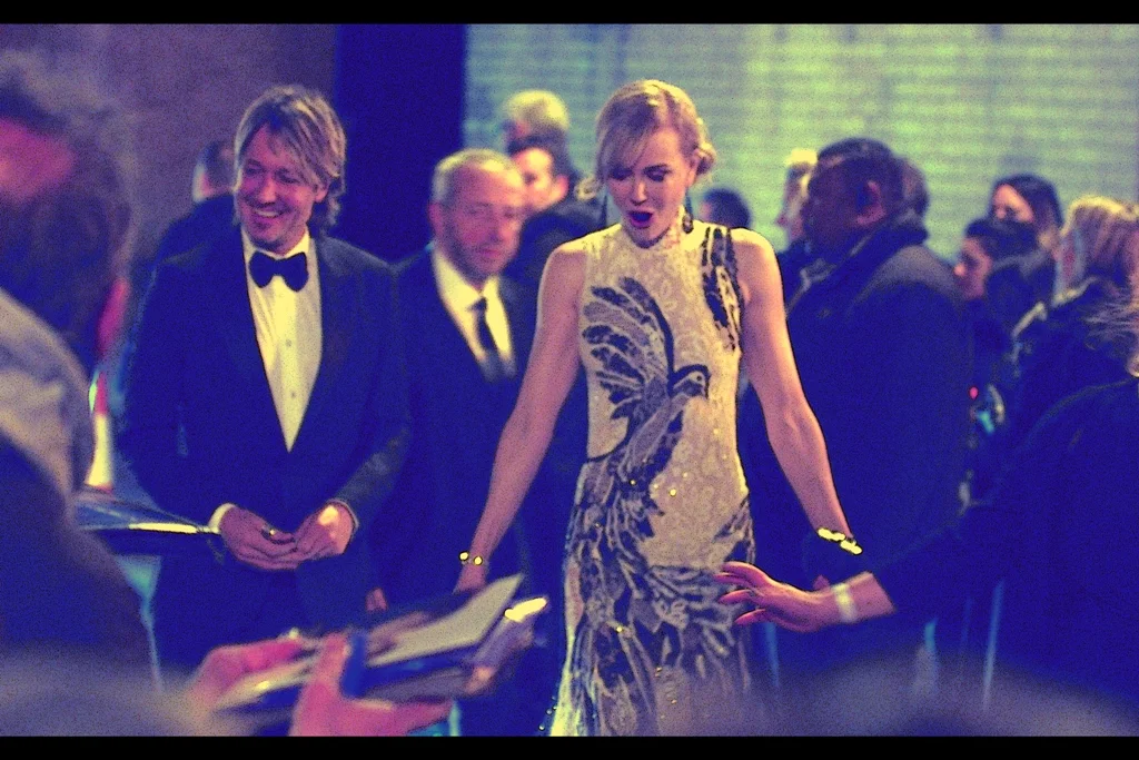 The thundering of the earth you're feeling is not a train on the London Underground or a micro-earthquake, but rather hordes of autograph dealers shifting location in a large continuous open publich pen to fight, bellow and parry for autographs from the newly arrived Nicole Kidman.