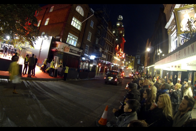 We take up the action outside a theatre, where We The Common People are united in one fact : we're not allowed across the road where the red carpet is. Presumably because we're not special, or famous, or (especially in my case) well-dressed enough. Or maybe we just weren't invited. For any of those reasons aforementioned.