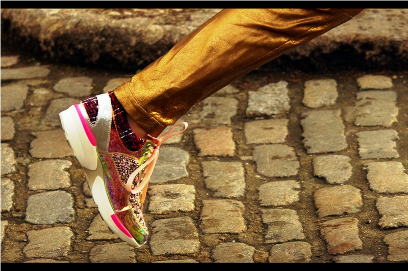 (possibly overheard) : "Those gold metallic trousers and colourful sneakers are so embarrassingly passe I could choke on my soymilk-caviar-latte... but the salmon pink coloured shoelaces? Those are divine (darling)"