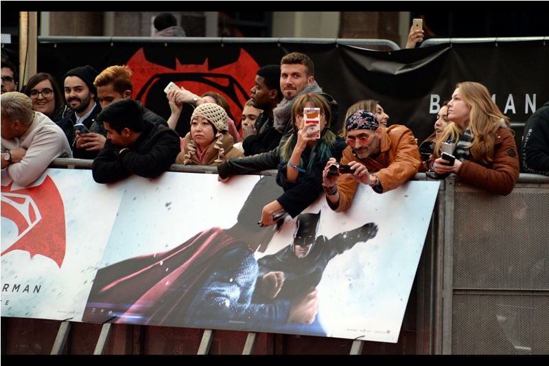 It's not about the two guys on the giant poster about to punch each other in the face. No... it's about the lone iPhone high in the background in the gap between the fencing barriers. Good luck holding it steady for the next few hours!