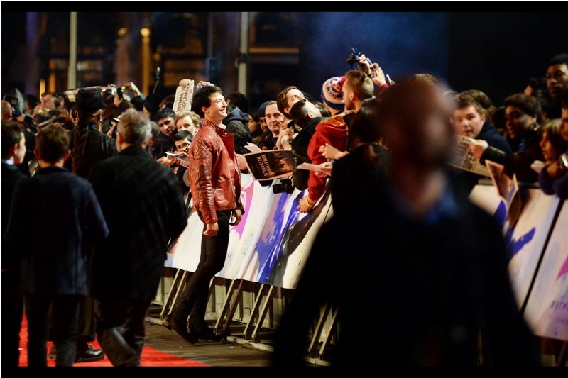 I believe this is Ezra Miller, who will play The Flash in upcoming films, assuming this Warners/DC Universe takes off. Which, to be fair, is going to happen no matter how bad these movies are because quality bears no strong correlation to box office in this world.