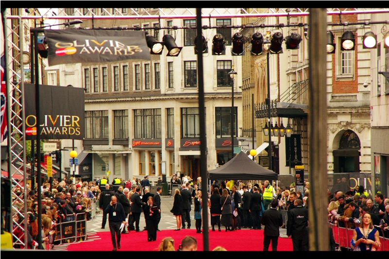 It's still another hour to go, but the carpet, the pens, and the glowering visages of Sir Laurence Olivier adorning the hoardings are all in place.