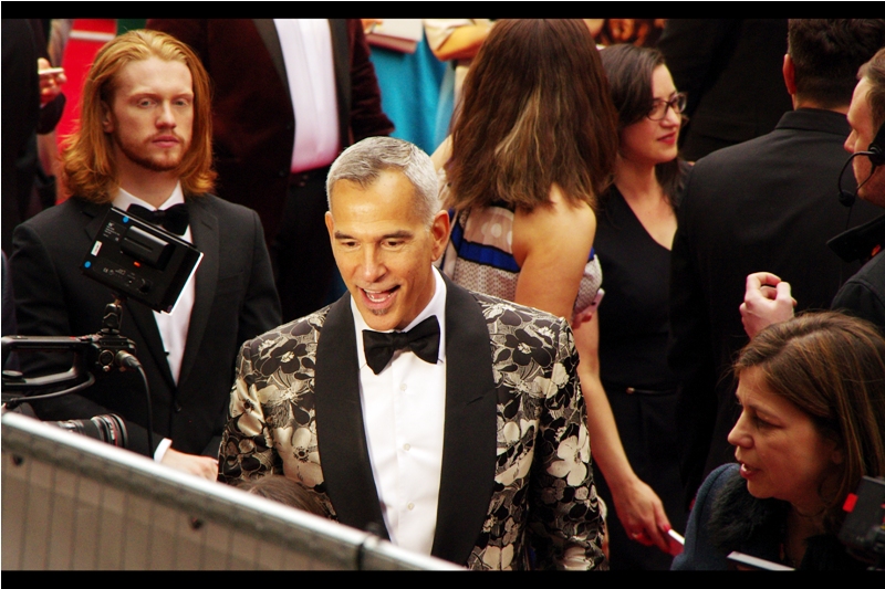 "Careful. This suit cost more than your education. It cost more than MINE, actually" I don't know who the person wearing it is, sadly But the jacket is magnficent.