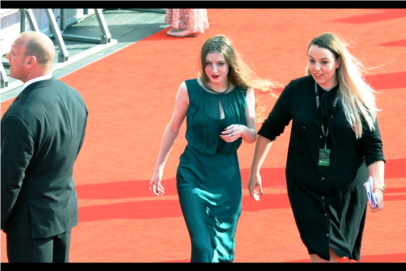 I don't know who this is, but people were shouting out either "Sasha!", "Saoirse!" or "Susan" to get her attention. I shouted "Steve!" just to add some variety. (edited to add : even more confusingly, her name is apparently "Birdy")