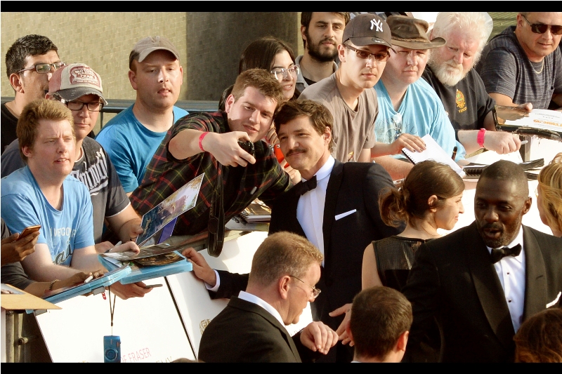 "Quick : take that photo with me now! Firstly, I've got a moustache, secondly Idris Elba's back is turned, and thirdlyTom Hiddleston hasn't hit the top of the stairs yet! I'm literally your best option RIGHT NOW!!"
