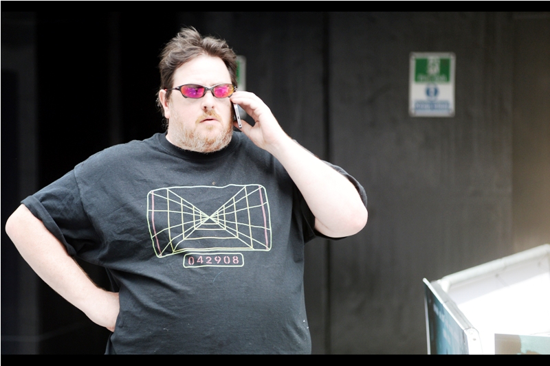 "Can't talk, Mom. There's a lamppost over there that needs me to lean seductively against it". I do like the t-shirt, though.