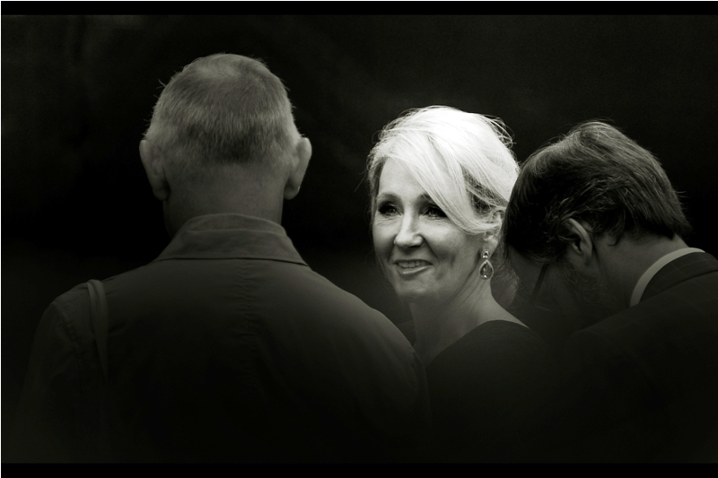 A car pulls up past the regular theatre goers, and its occupant is fairly recognisably J.K.Rowling - author and creator of Harry Potter, who I previously photographed at the Harry Potter premieres for The Halfblood Prince and The Deathly Hallows part2