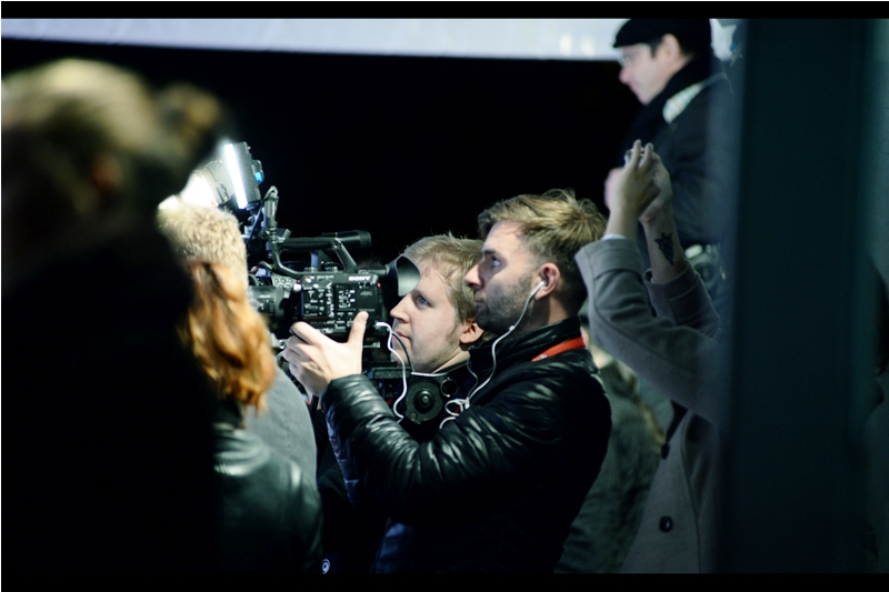 It's not just about the intense looks from the two cameramen or the dude behind them with his mobile phone... it's also about the guy in the background looking like the rebooted Zachary Quinto Mr Spock from Startrek. Or it could be the cold and the sugar rush from the Starbucks Pumpkin Spice Latte. But it's probably the cold.