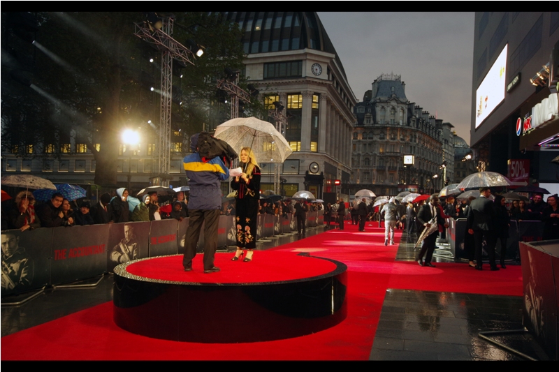 I've strategically shifted position to a spot in a newly opened pen giving me a view down the carpet, hoping that the interviews will be held in precisely this direction (I may be suffering chronic sleep deprivation after close to a fortnight of BFI London Film Festival, but some of my instincts still work) (as far the instinct to bringing an umbrella to this thing? Sadly lacking)