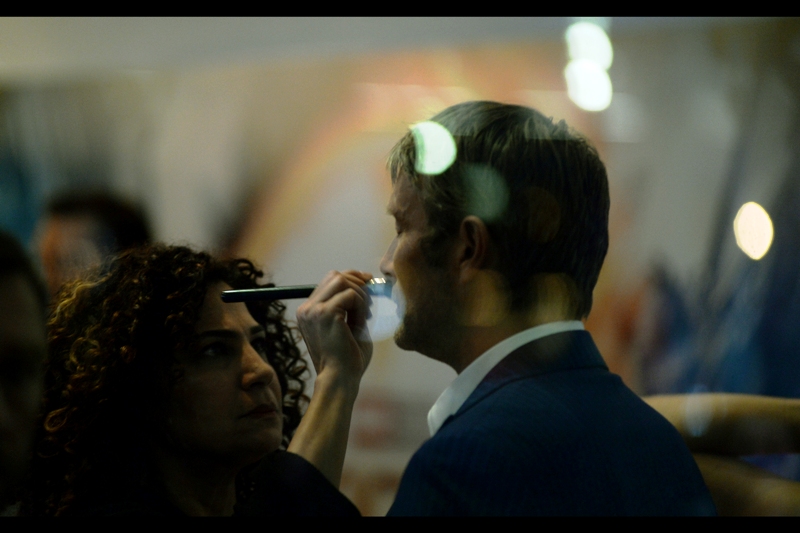 "Mr Mikkelsen, if they're going to shoot you through anythin gother than glass or maybe underwater, I'd better touch this up a bit. Also, you're kind of hot and maybe my fingers will brush against your hair just so-- "