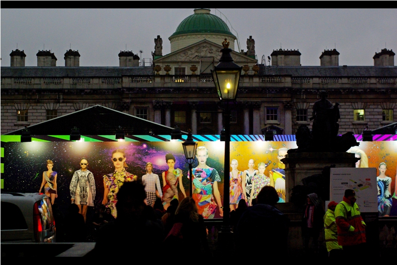 From within the bowels of London Fashion Week HQ : "We spent thousands on that mural and they're parking vans and putting neon-jacketed security people in front of it??"