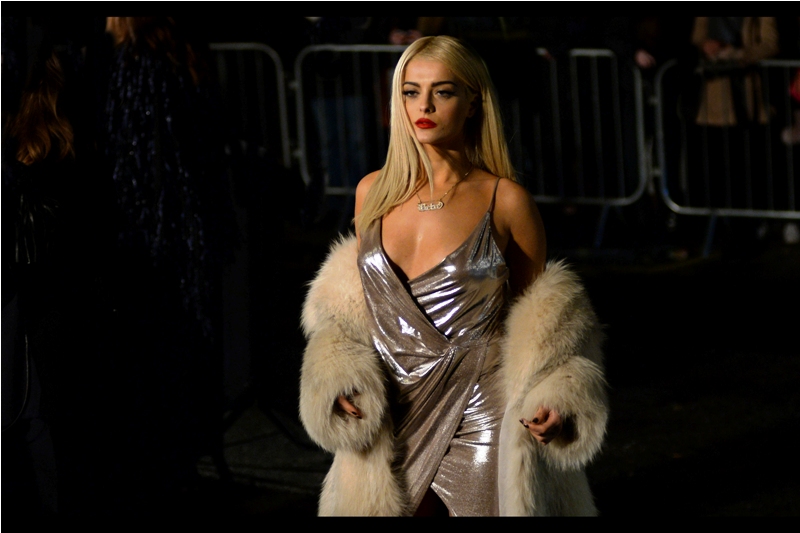 I don't know who this is, but the name on the necklace is "Bebe". (I had to look closely. For... clues, you understand)