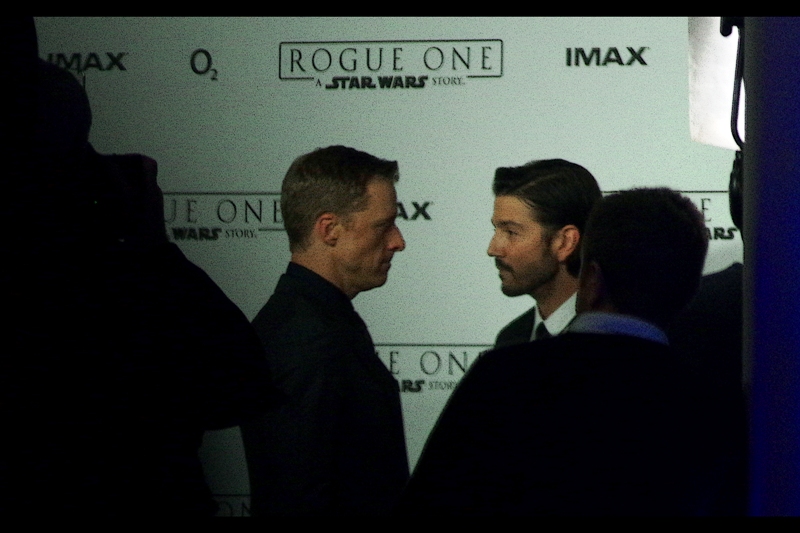 "Ssup, bro?" "Ssup" - the guy on the right might be Diego Luna, and the guy on the left might be Alan Tudyk. They might also be exceedingly happy to see each other.