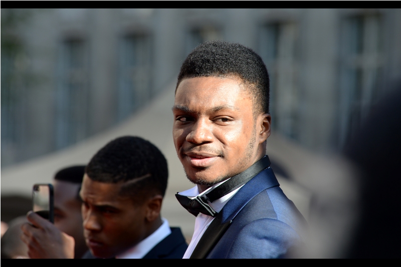 Sadly I don't know who this is, but, you know.... bow tie means that he's in focus, and not the guy in the background with the intense focus and the slice through his hairstyle.