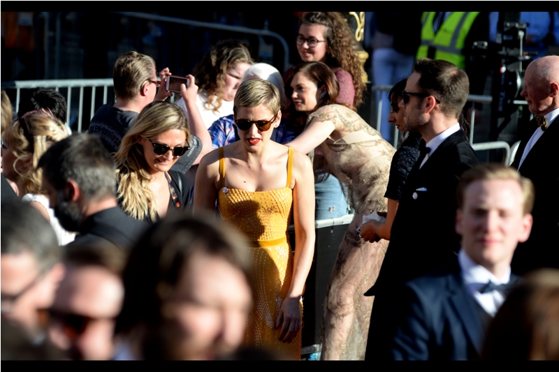But before Brian May's hair had a chance to obscure views of Ruth Wilson, there were about a hundred people and a woman wearing sunglasses and a yellow dress.