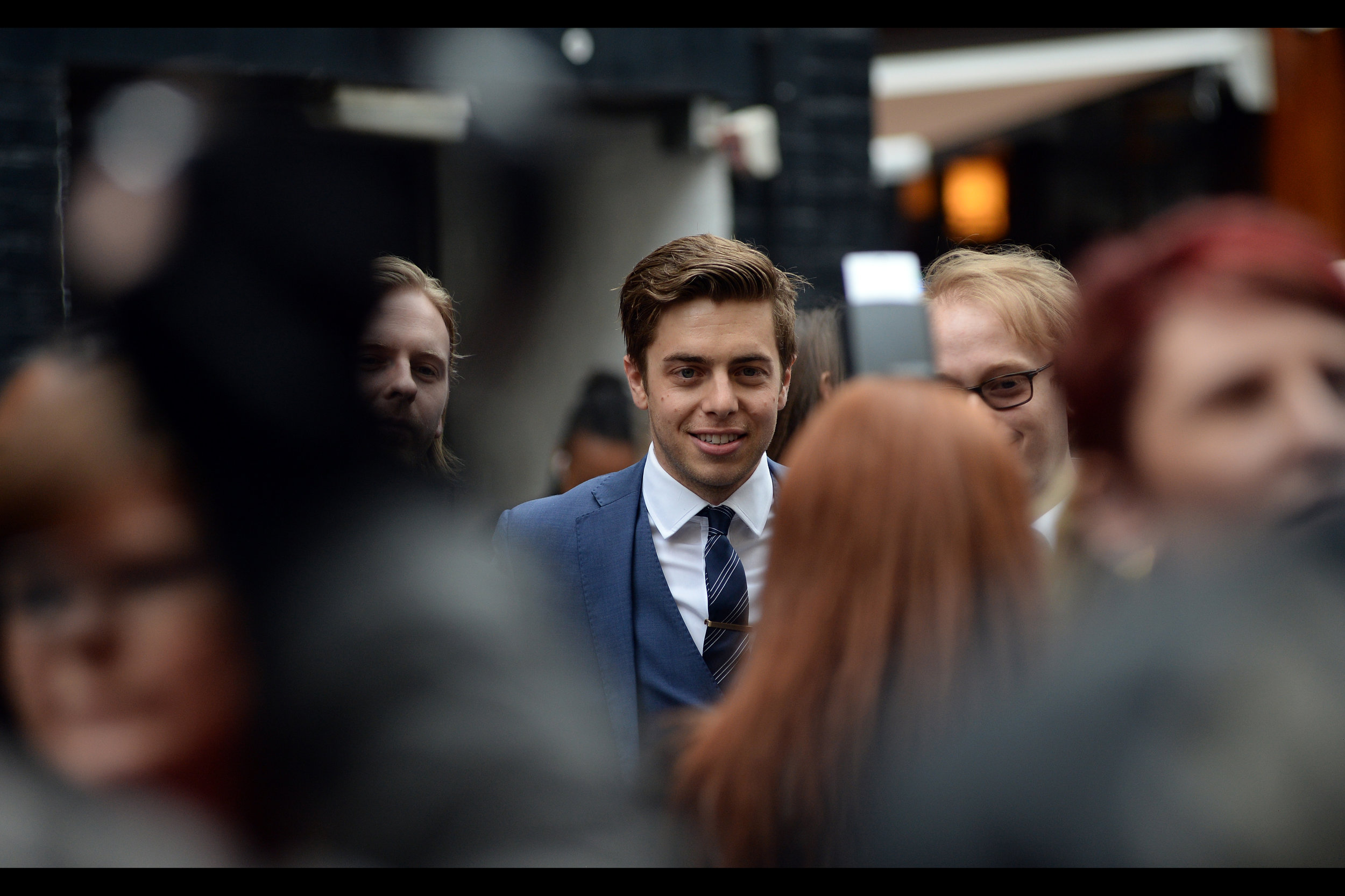 I think he's in the movie. And the tie has an executive producer credit.