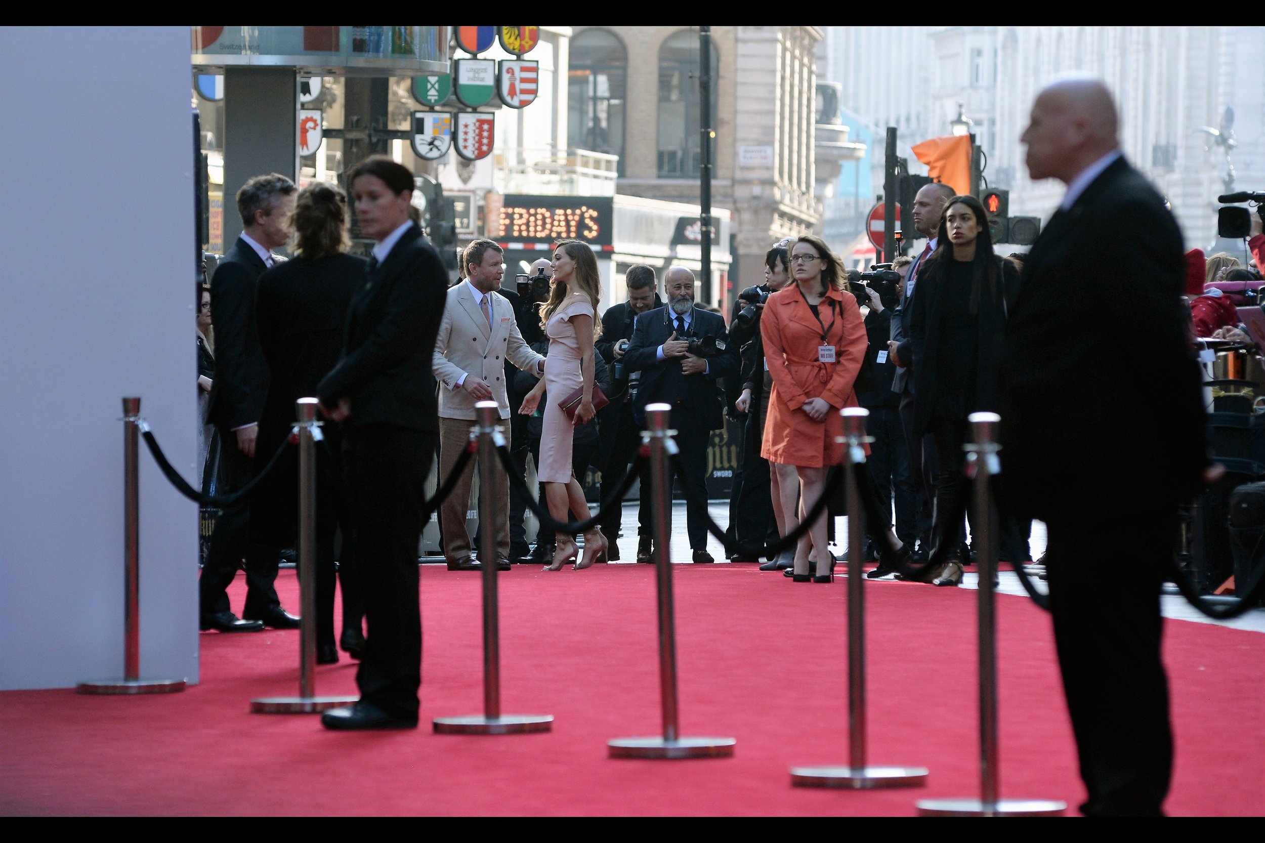 A row of velvet-rope barriers to create a barrier between ordinary ticketholders and the movie's stars being interviewed on the red carpet which also has the effect of blocking crowd views of those same stars being interviewed, and stops them easily signing autographs. Frankly, I think we're six months from having fully-excavated Talent Moats to divide the stars from the commoners.