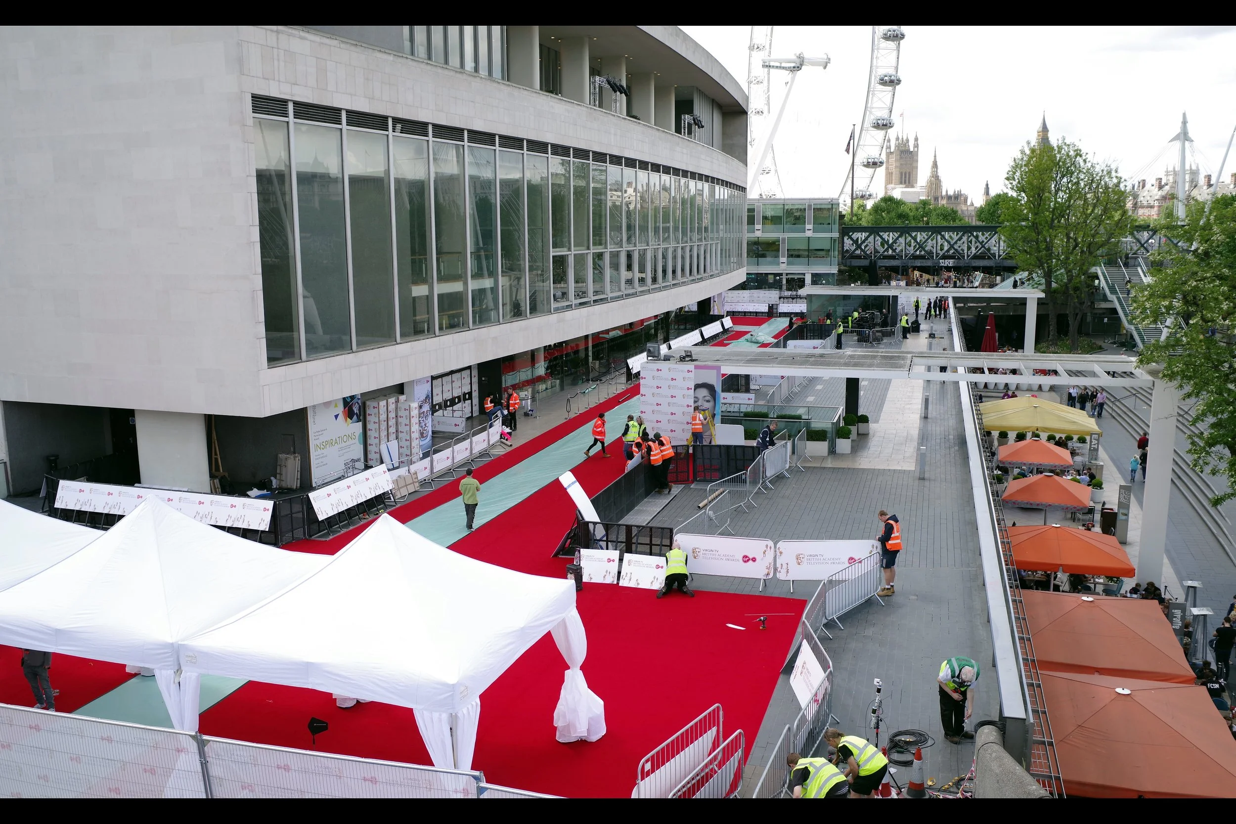Distressingly, this is the view from the stairs. Those white marquees? They weren't there last year. That empty space on the right? That was a fan pen last year. Clearly last year's spot wasn't going to be this year's spot.