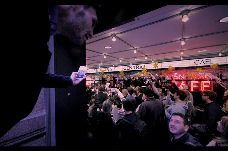 "Who's that being mobbed?" "Don't know" "What movie are they promoting?" "Don't know" "Then why am I risking my safety taking this photo???" ... the film's main draw Rachel Weisz has arrived, to a flood of dealer autograph requests.