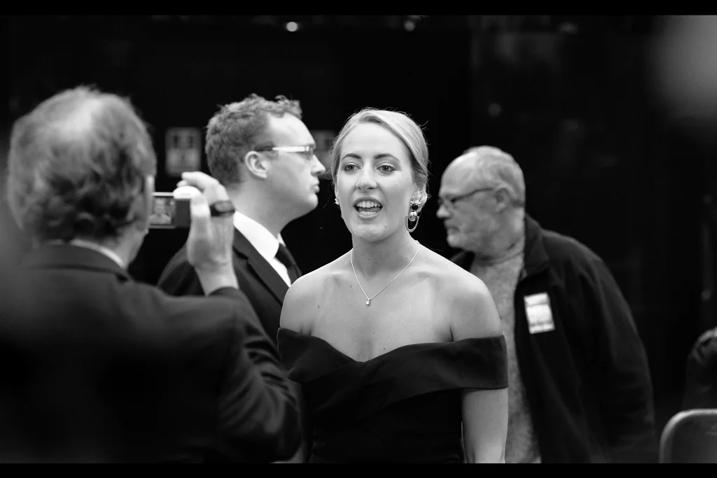"Terry, you'd better be taking a photo of how elegantly awesome I look and not making weird compositions incorporating the guys behind me..."