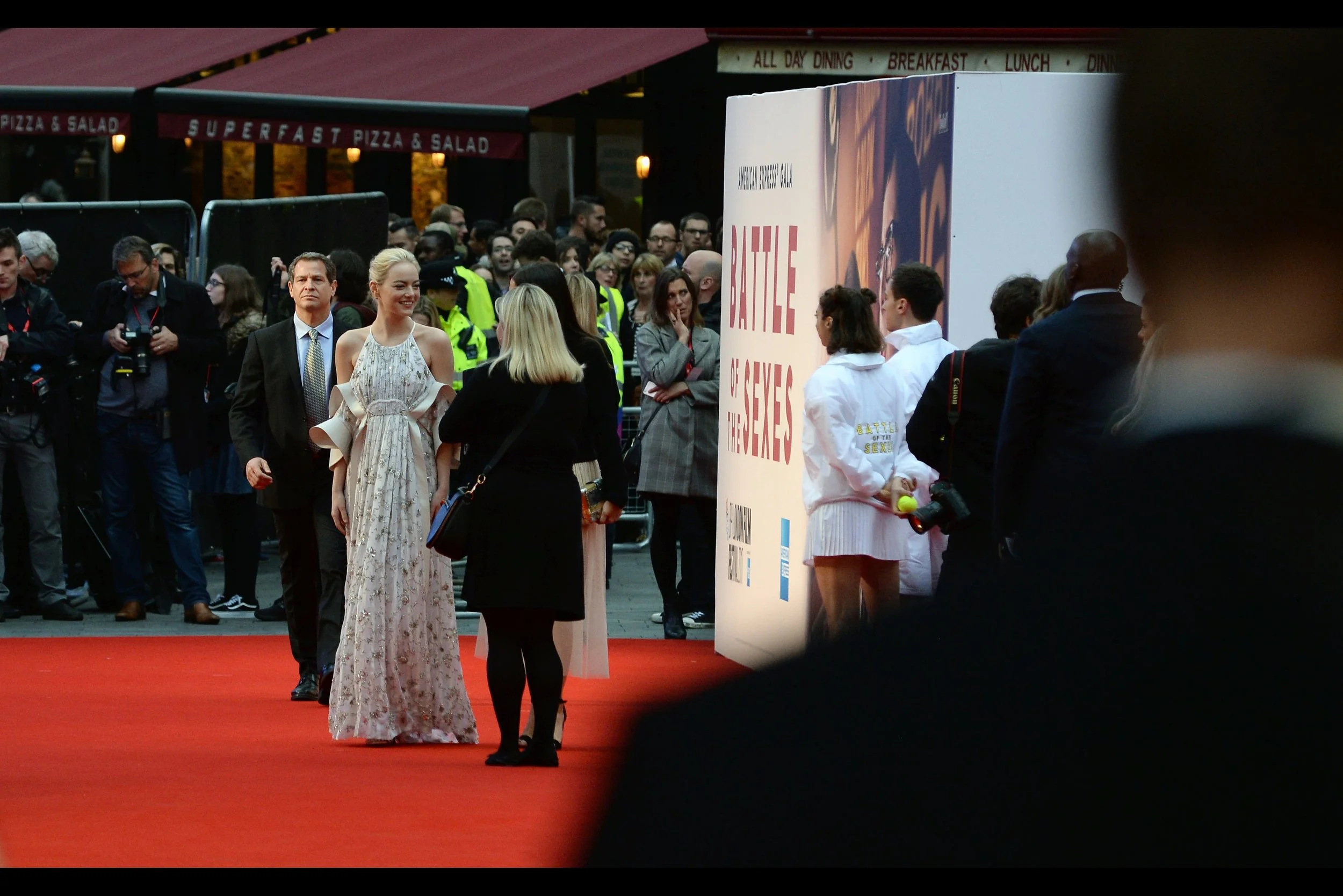 "If you need to fix those shoulderpads, dear, the carpet guys left behind some masking tape?" - Emma Stone is wearing what can be conservatively labelled as "a dress" to this premiere. It also looks vaguely like the curtains I inherited in my prior apartment.