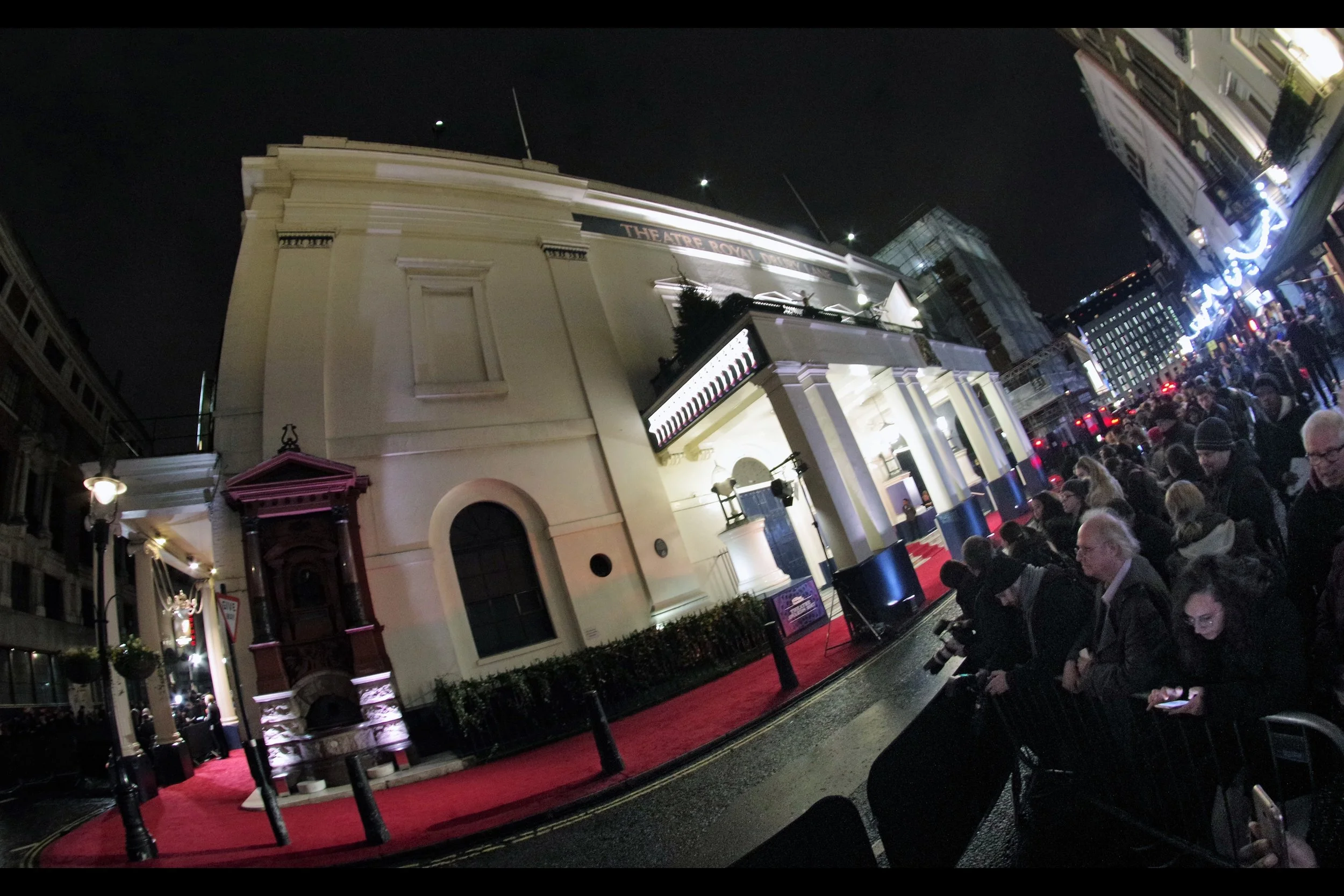 Sick(ish) of the blocked views of foliage around the corner, I've decided to shift position to the other side of the Theatre Royal Drury Lane, which as noted is not on Drury Lane. still.. hopefully even with the shoving of autograph dealers and lower levels of light, the angle for photography might be better. I hope.