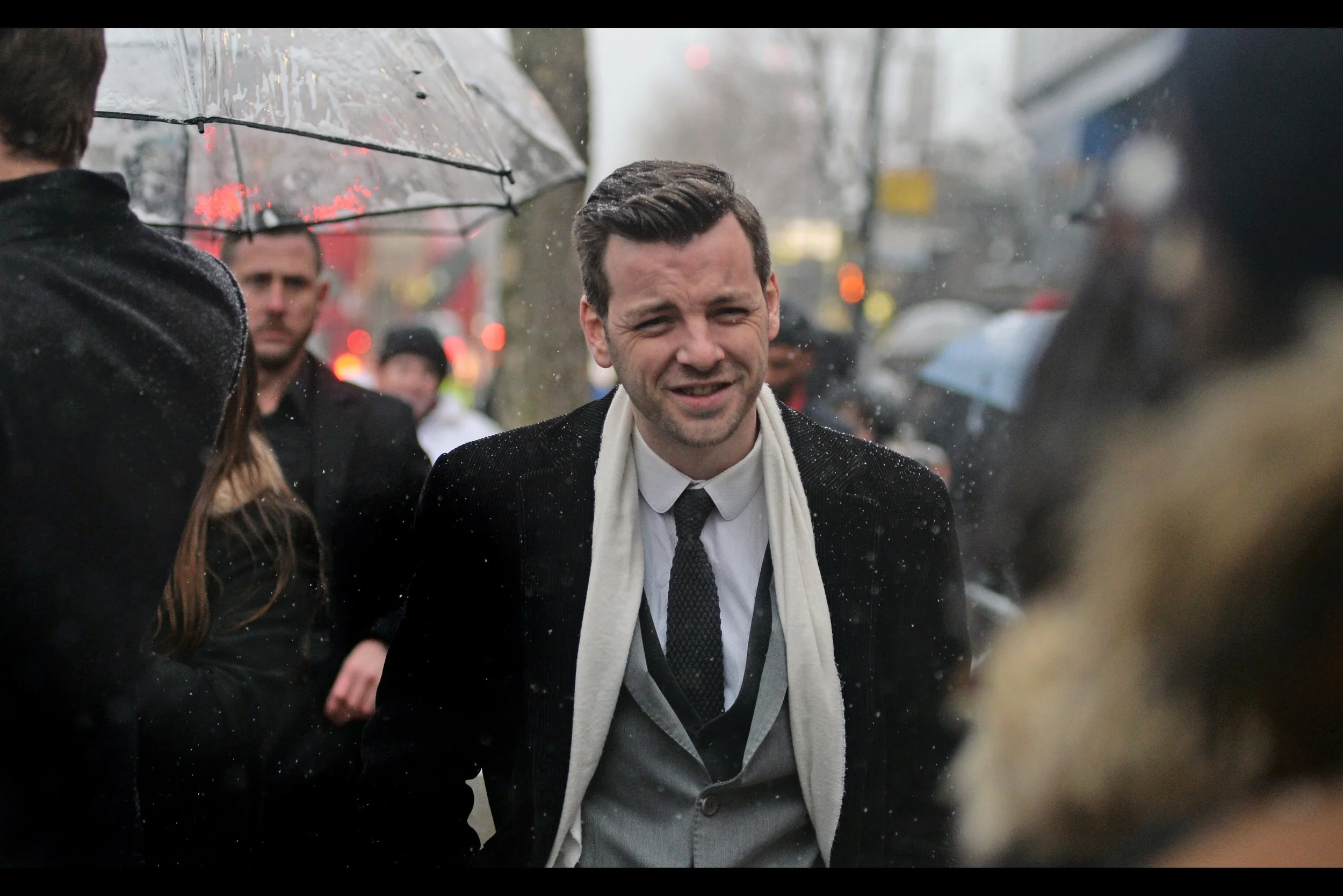 I also don't know who this is, but at most events my policy is that any woman with a glamorous enough dress gets photographed, as does any man with a glamorous enough scarf. And here we have a coat, vest, suitjacket, tie and shirt as well. All that, and a tiny hand just behind him too. It's been a great event so far..... though in other news, I can't feel most of my toes.