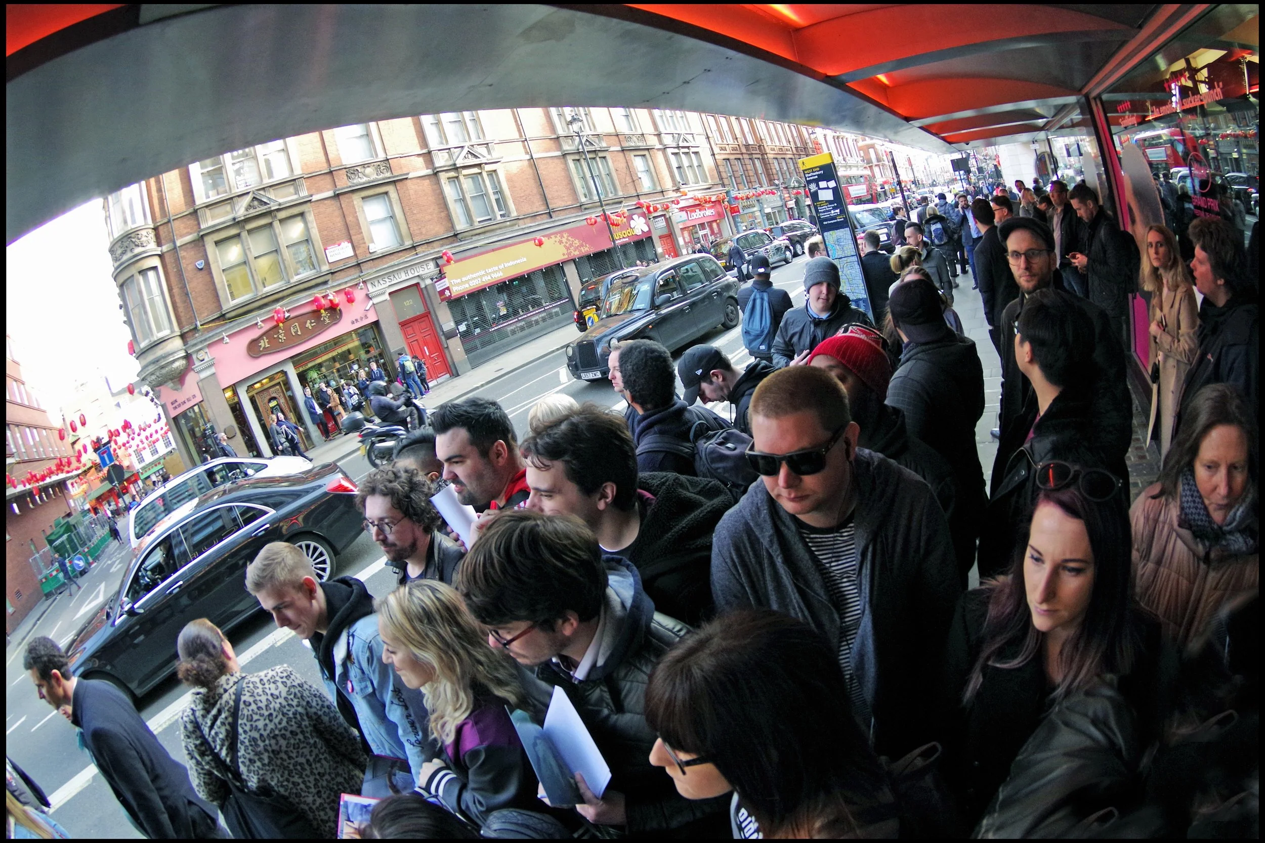 The few, the proud, the just-standing-here-not-saying-anything-to-passersby-that-might-encourage-them-to-add-to-the-crowd.