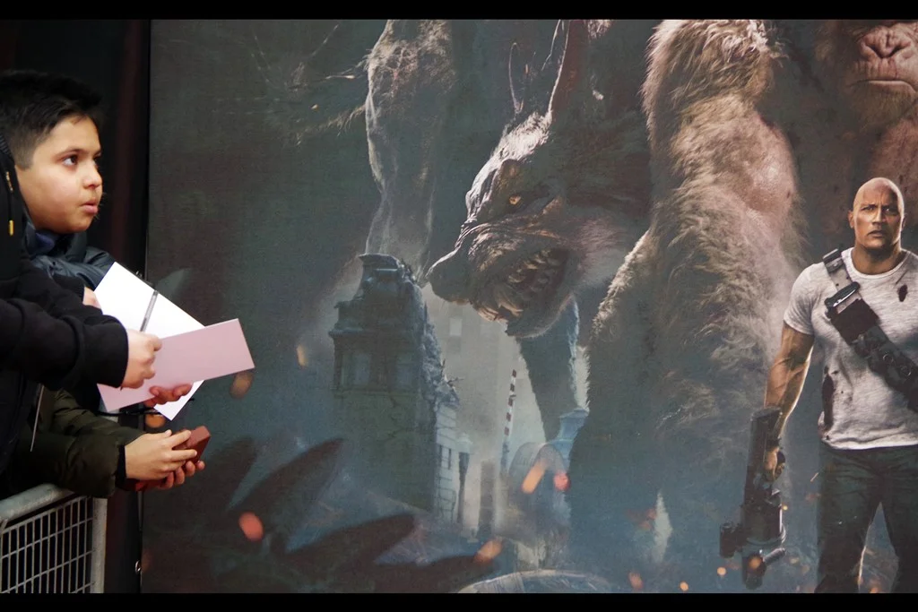 "Help me, photo of Dwayne Johnson's right bicep. You're my only hope"