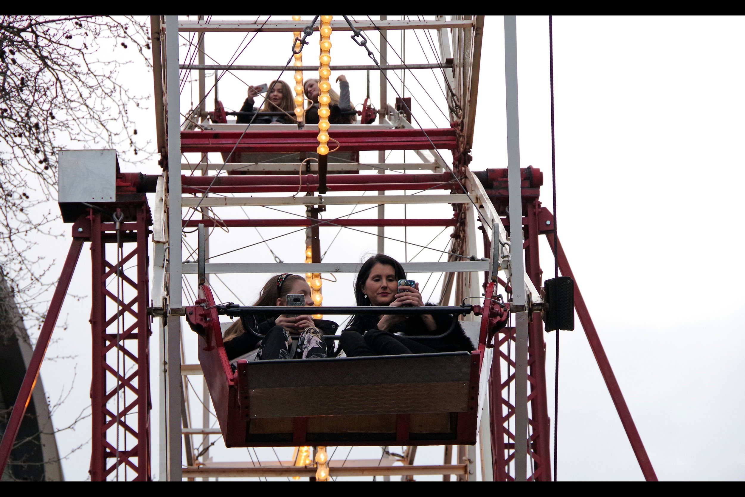 True fact : you can't ride a ferris wheel without spending most of the ride on your mobile phone texting everyone you know telling them you're on a ferris wheel. (Or taking a selfie of yourself with a grey sky behind you that it would be otherwise almost impossible to take from ground-level)
