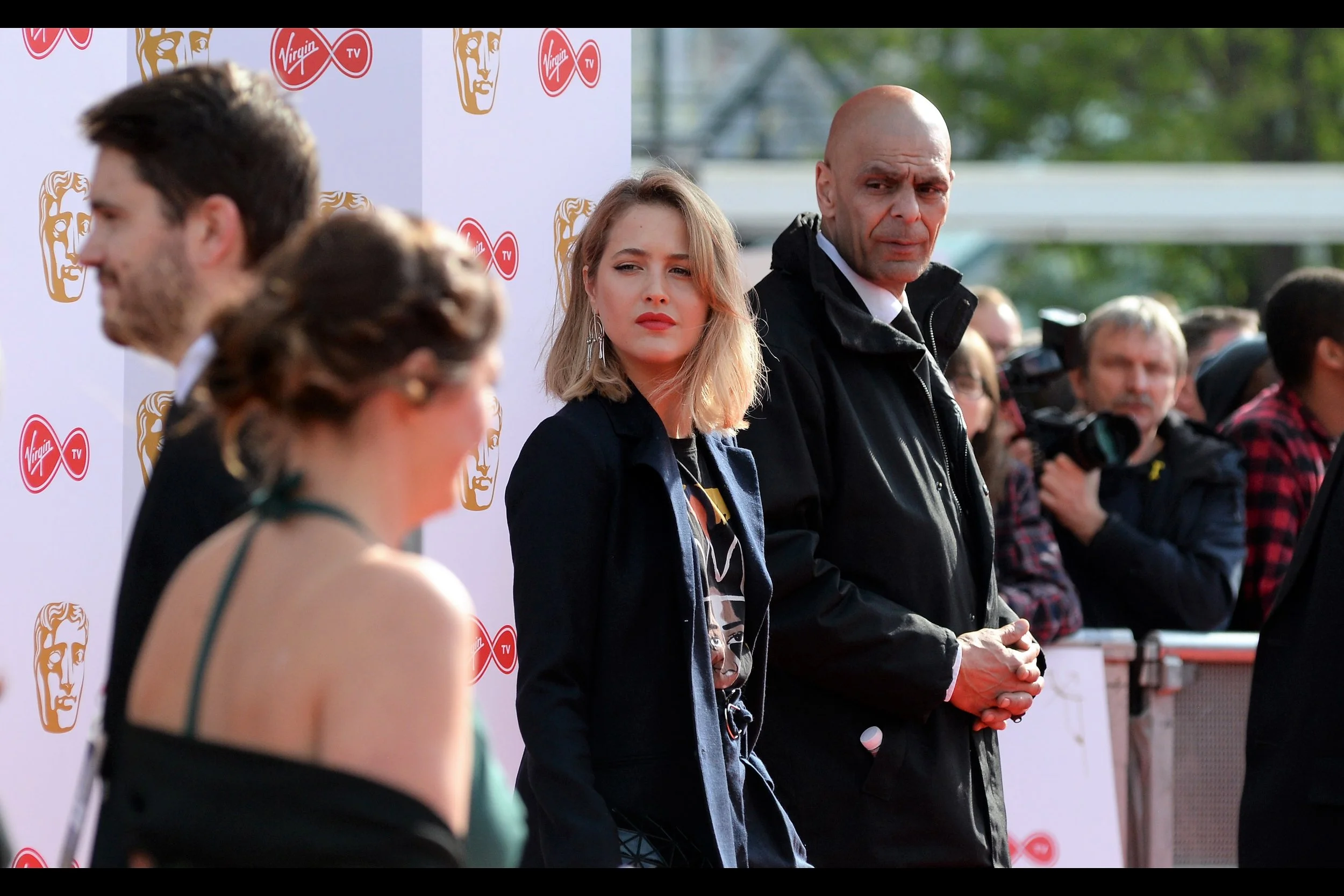 I don't know who this is, but wearing a suit jacket with T-Shirt underneath is something both I and Tony Stark do, so I think that's pretty cool.