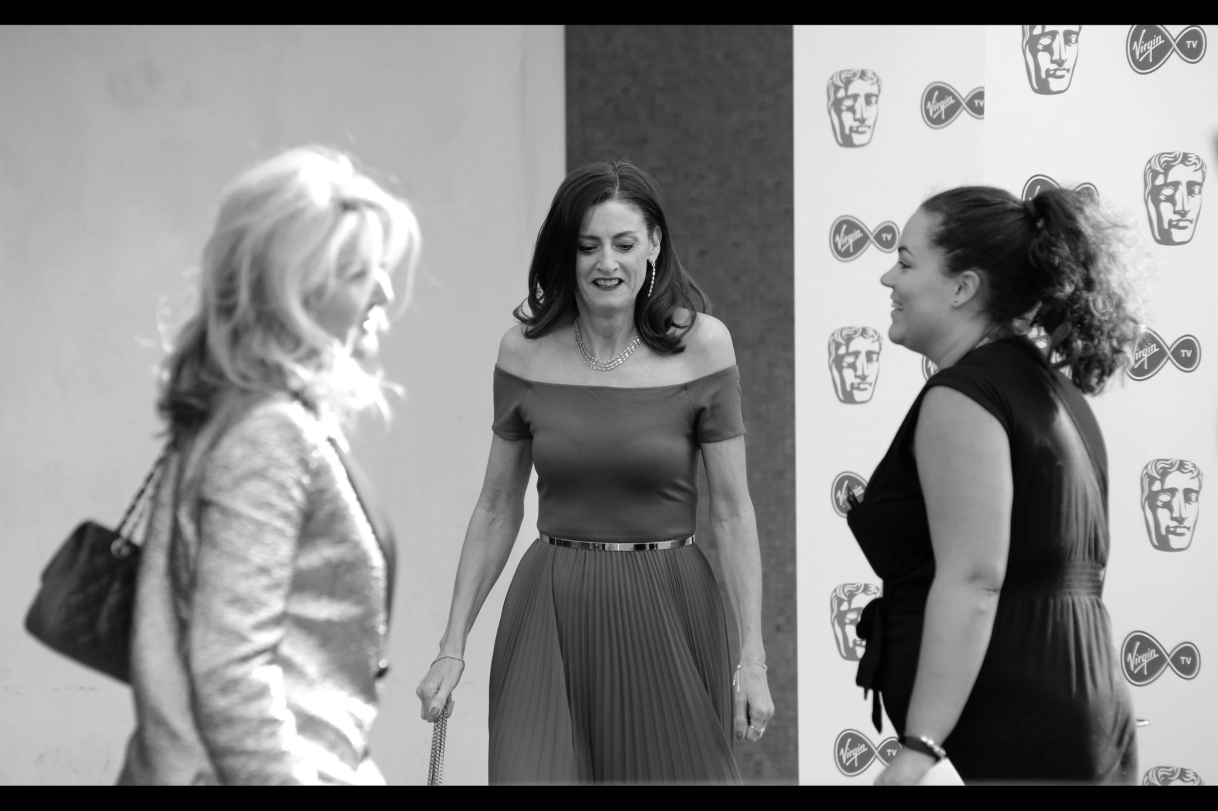 I feel like I should know who this is, since I'm about 80% certain I photographed (and probably even identified) who this was when she attended LAST year's TV Baftas .