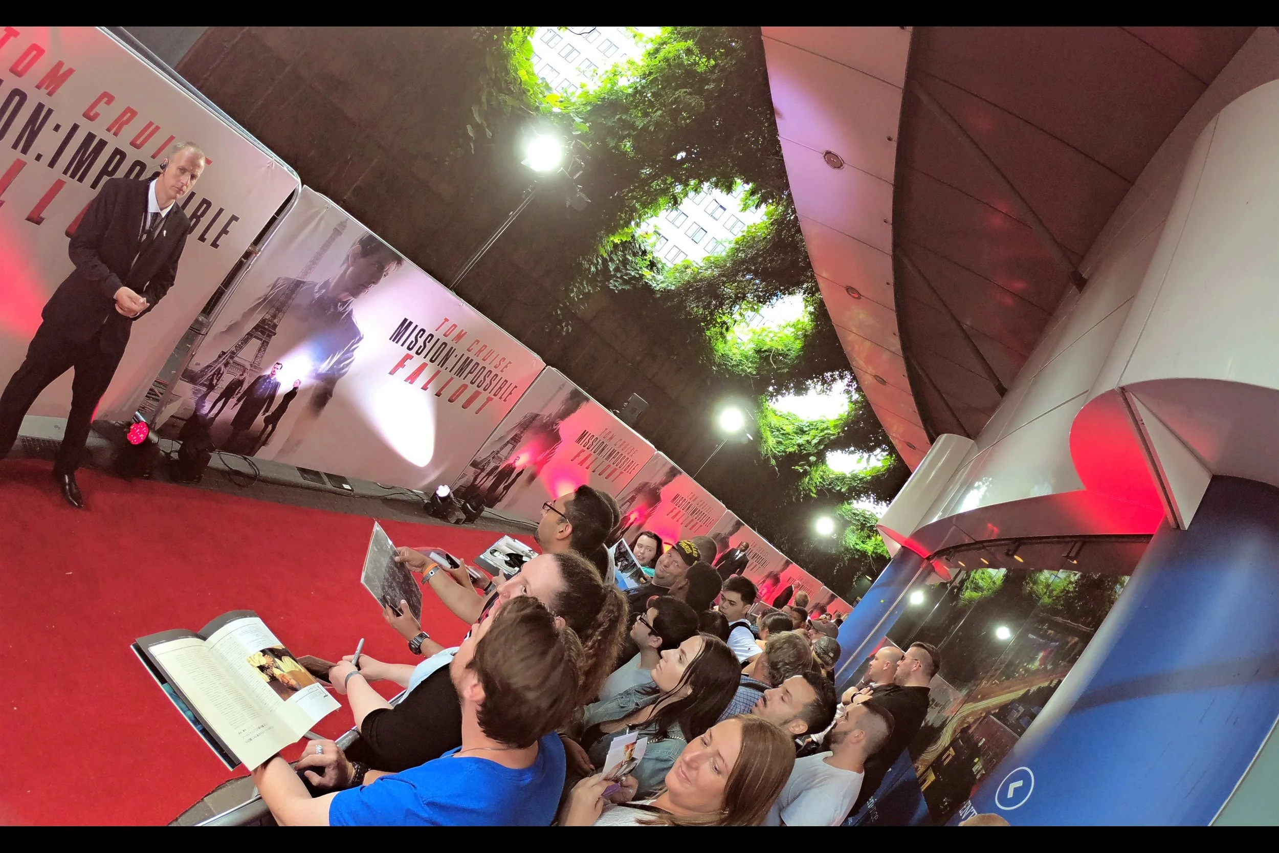 So I've found my spot. It's in the second row, among a throng of fans and autograph dealers. Up above, in the gaps through the foliage, is where I would typically be found, taking unobstructed photos and hoping that Security would allow it.