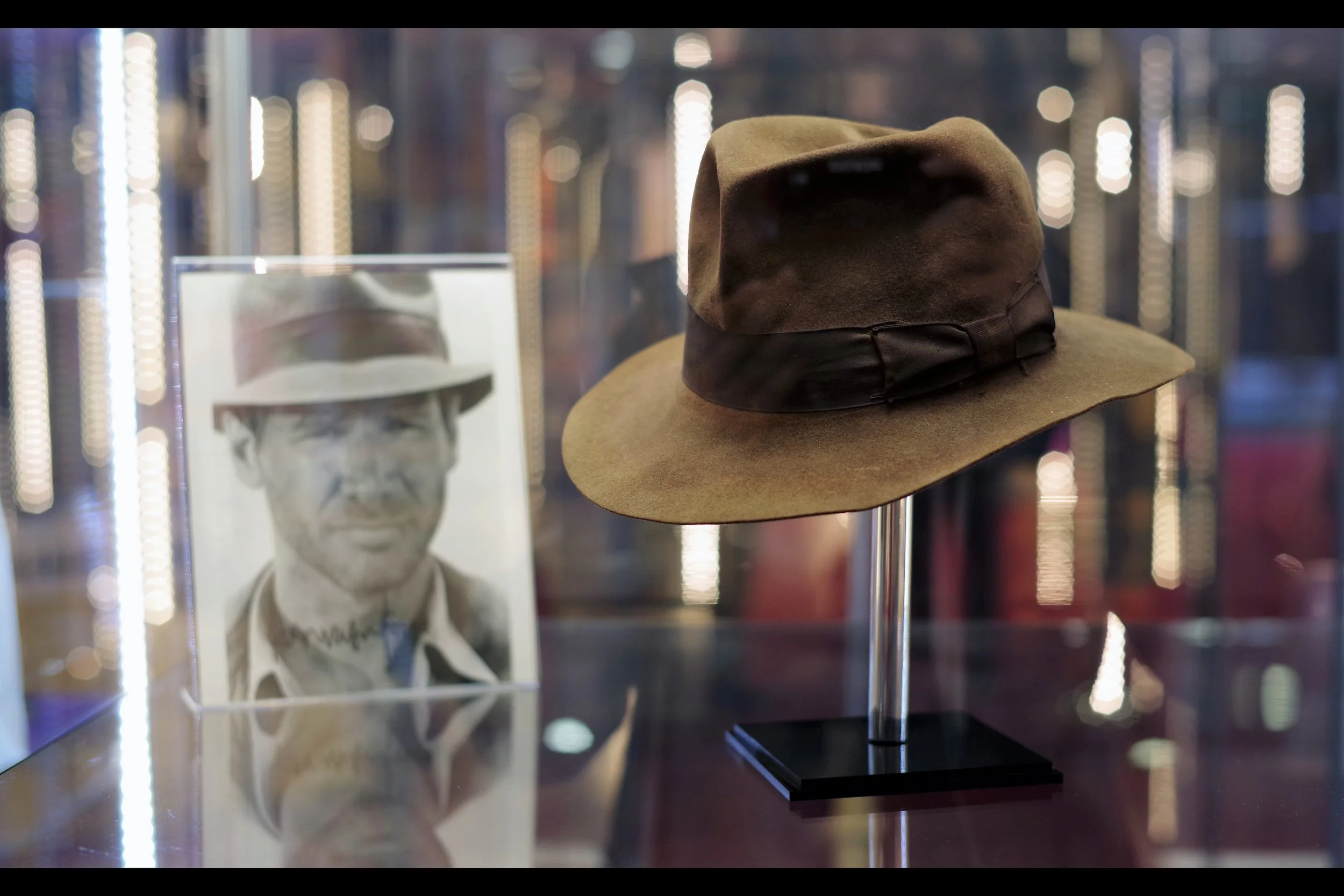 Honestly, I'm not sure if the autographed photo is included with the Indy fedora (or if even the hat stand is), but with a Starting bid of £100,000 I think it's important to ask these questions. (Winning bid : £325,000) I've since learned that the photo is being sold separately. Starting bid: £100, bidding at £600 four days later… winning bid £900
