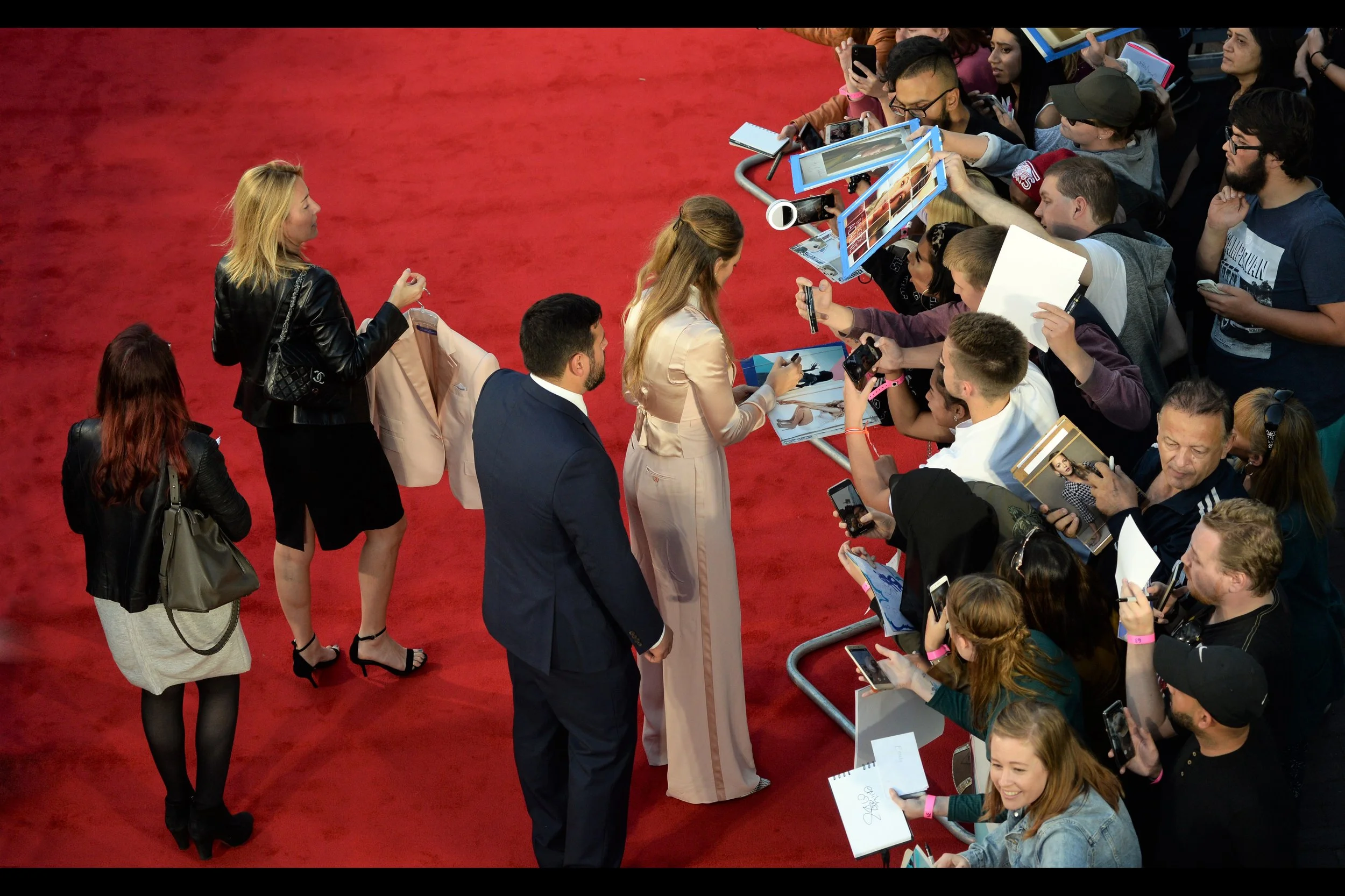 Blake Lively also has a lady who holds an additional satin-y jacket just in case she needs some variation in stylishness. I did bring my LA Dodgers baseball cap to this premiere… but I’m also currently not wearing it.