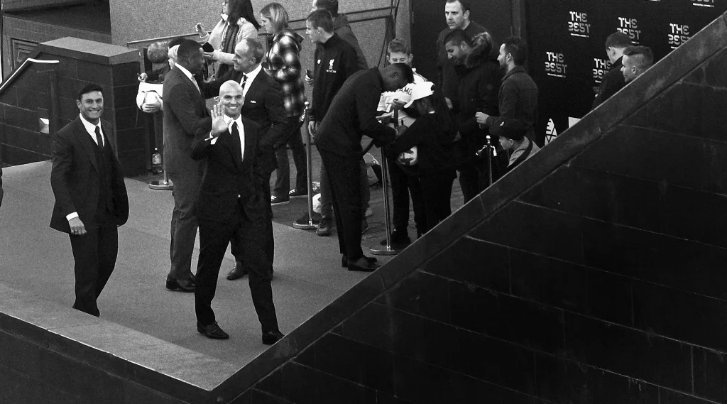 “Please… any closer and I’ll have to get this suit reupholstered” - the fans in my area were generally goodnatured, though their chanting and names-of-players-shouted-out-and-at were on the Spanish/ Uruguayan/ Italian side of Central London. (edited to add : I don’t know who this is)