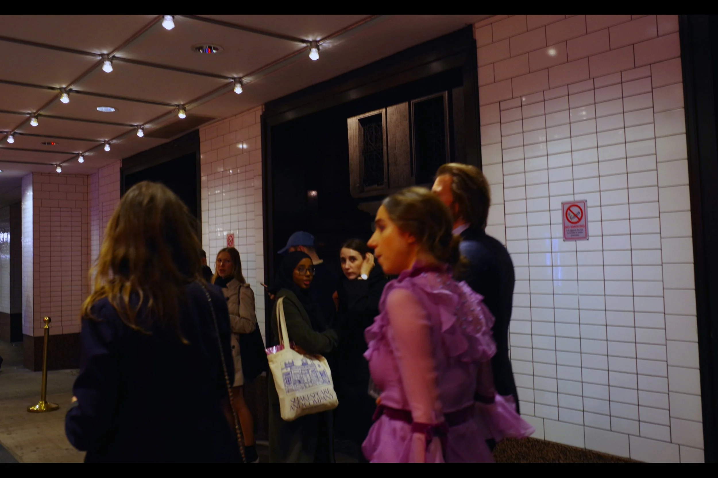 So I’m just standing there, C-list autograph dealers standing dully around me when I notice something purple/mauve walk past me. The shot sucks but the reflexes are pretty good,