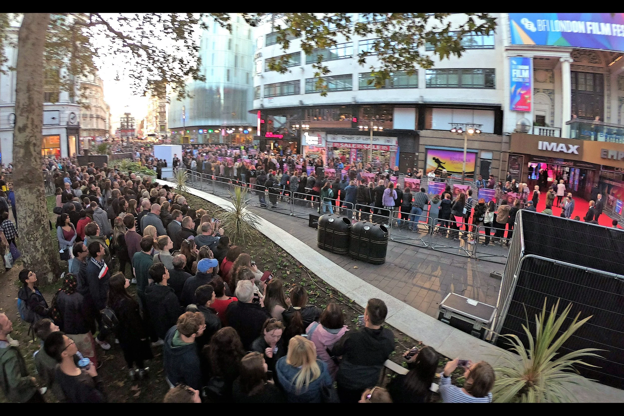 I’m on a step-stool in the park taking photos long-range. You’ll notice that while the public pen on the carpet has its crowds just 1-deep, the crowd in the park is between four-and-six deep. If there’s a better metaphor for both (1) the snobby elitism of BFI (2) the assholishness of event security, I’m not likely to find one.