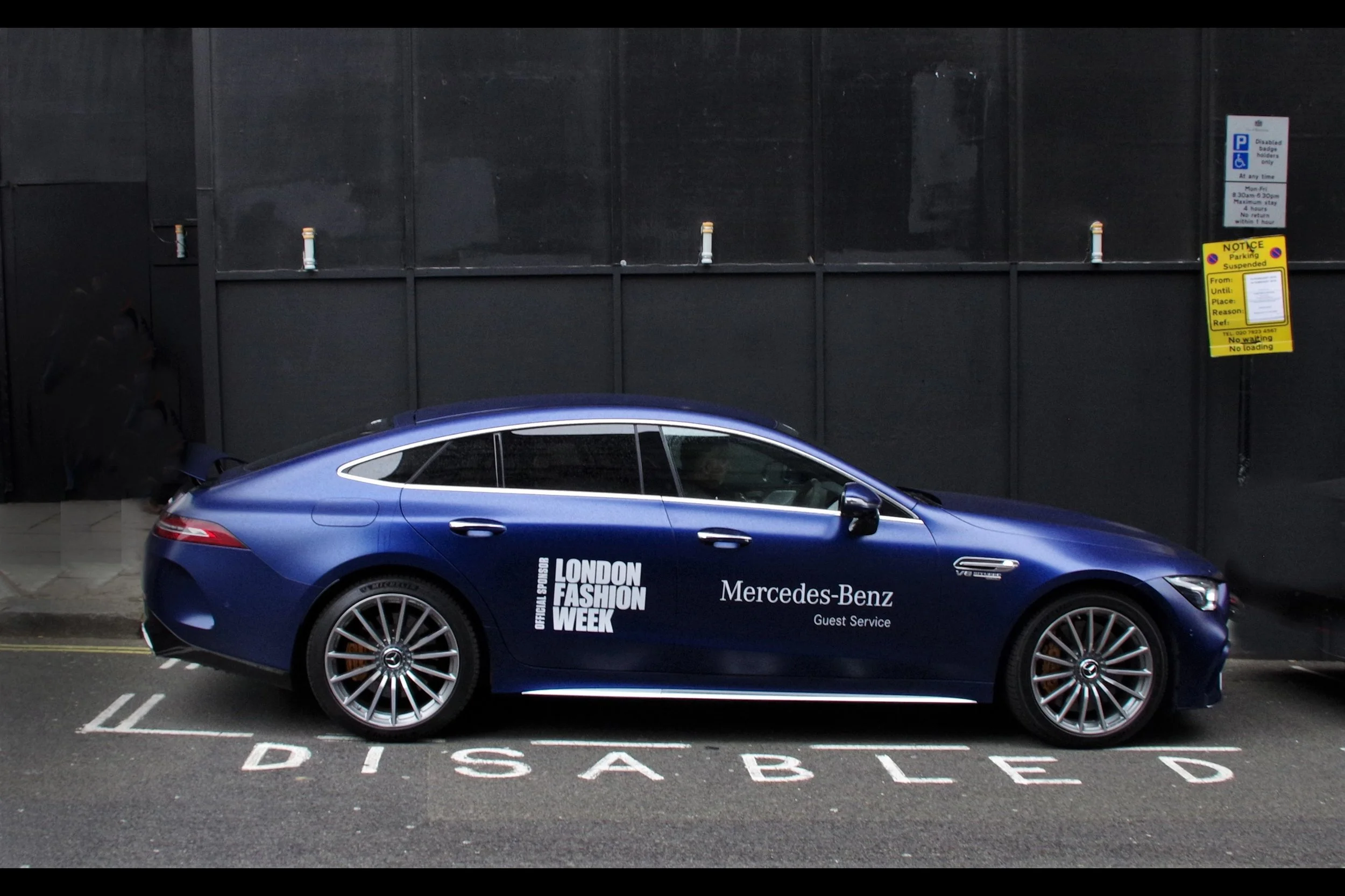 Seems a bit too easy to write a comment… but they probably should paint over it with something like “fabulous” or “sexy” for the duration of LFW, especially since they went to the trouble of having parking suspended there…