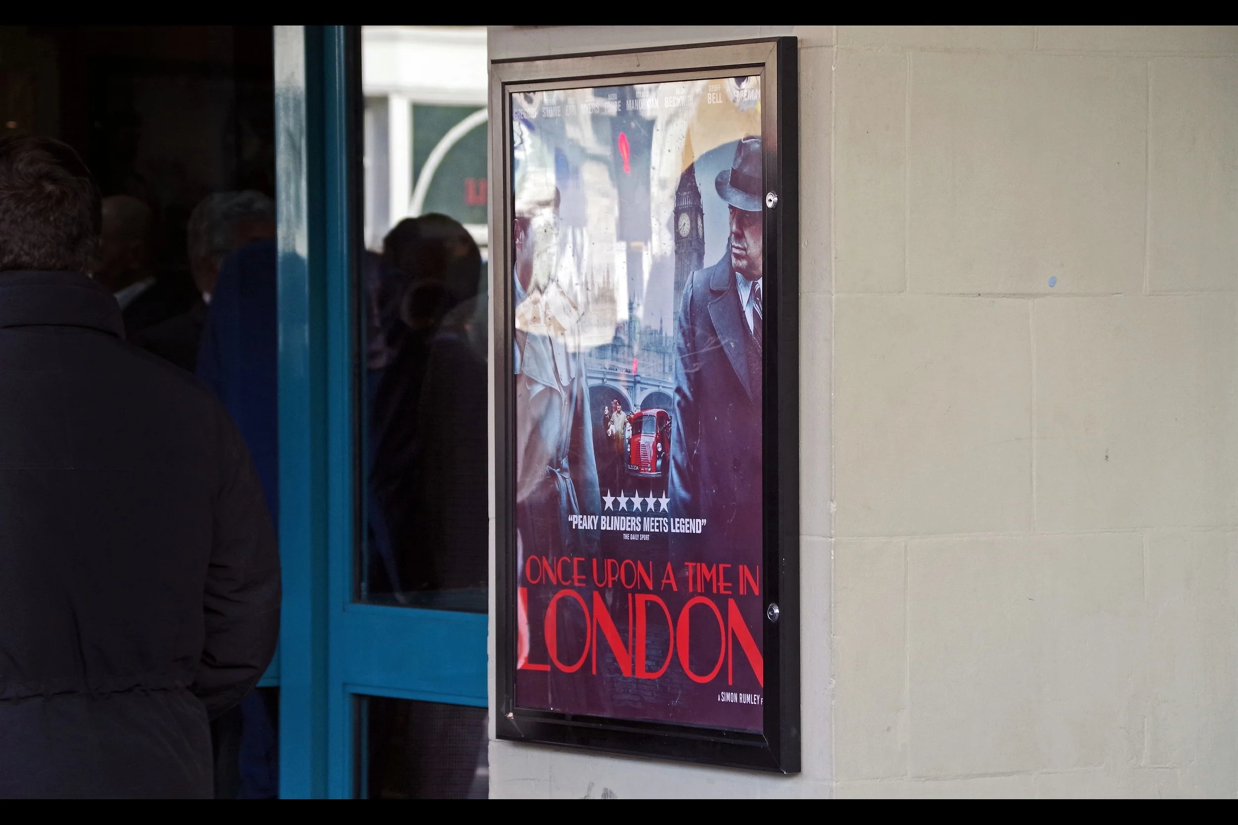 The movie is “Once Upon A Time In London” and though I can see a few buildings I recognise in the far distance, and I was able to make purchases at a local establishment using British Currency, I have to admit I feel like a bit of an outsider here. You know…. beyond merely being outside…. the cinema I’m outside of.