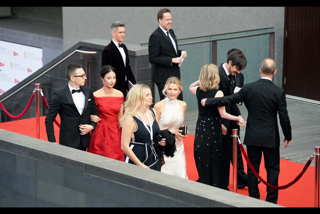 I don’t actually know who any of these people are, however the latent OCD in me as a photoeditor can’t help but notice (at any magnification) that there is a strand of hair across the face of the lady in the white dress and there is NOTHING. I. CAN. DO. ABOUT. IT. (edited to add : Lily Travers)