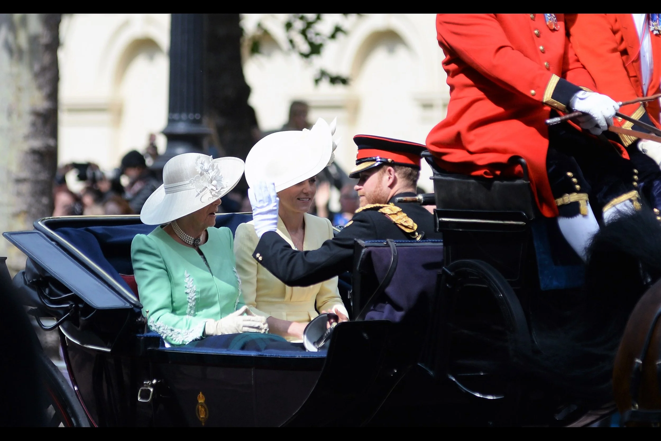 Giant hats, intermittent shade, a pollen count verging on the apocalyptic, and even on my two-step ladder I’ve got mobile phones and cameras I’m shooting through…. all that and there’s the matter of the carriage carrying these four royals is hightailing it down The Mall. It seems the Royals are running somewhat late.