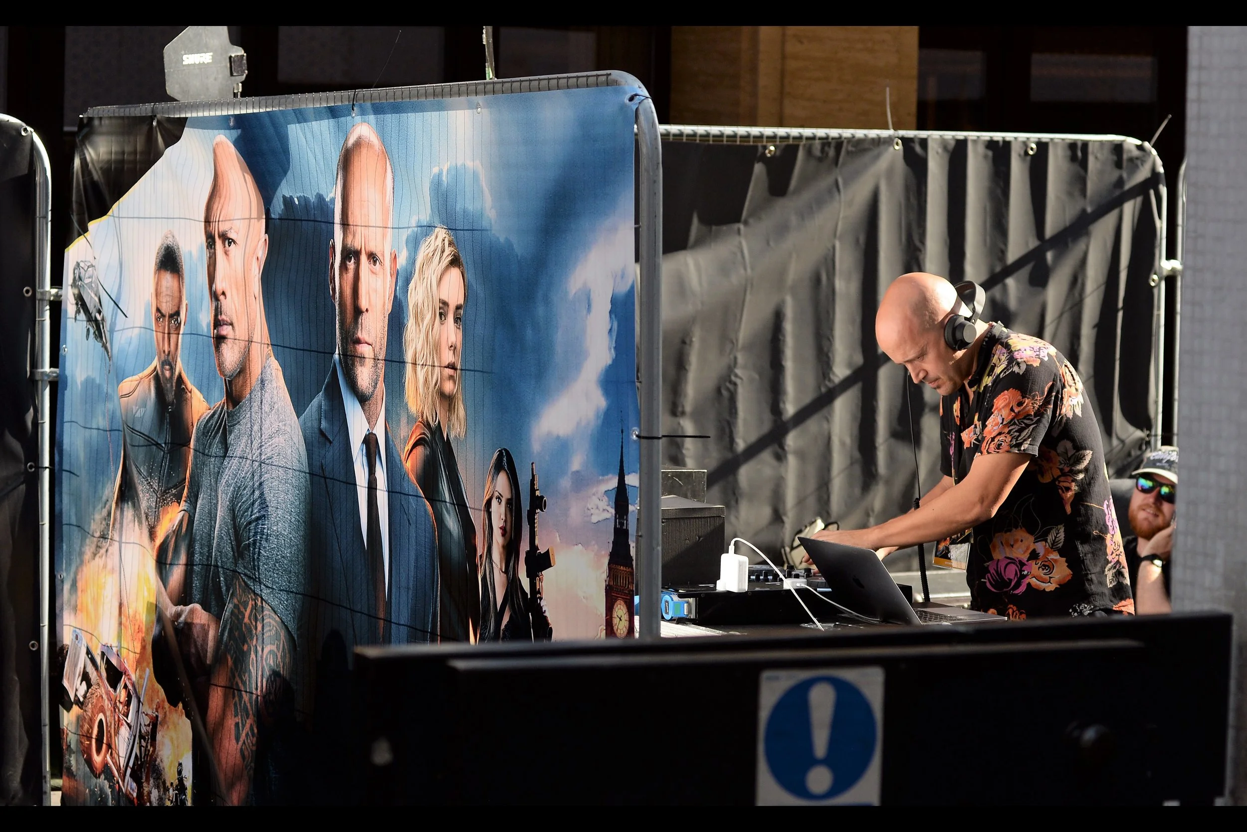 To the dismay of all present, your good friend and mine Mr Impact and his tame DJ Franch-Issize were not here to host the warmup. To this day I have never seen him at a premiere in Mayfair. But given this movie’s two leads are men with minimal hair, it makes sense that even with this shirt, our Deejay was this man.